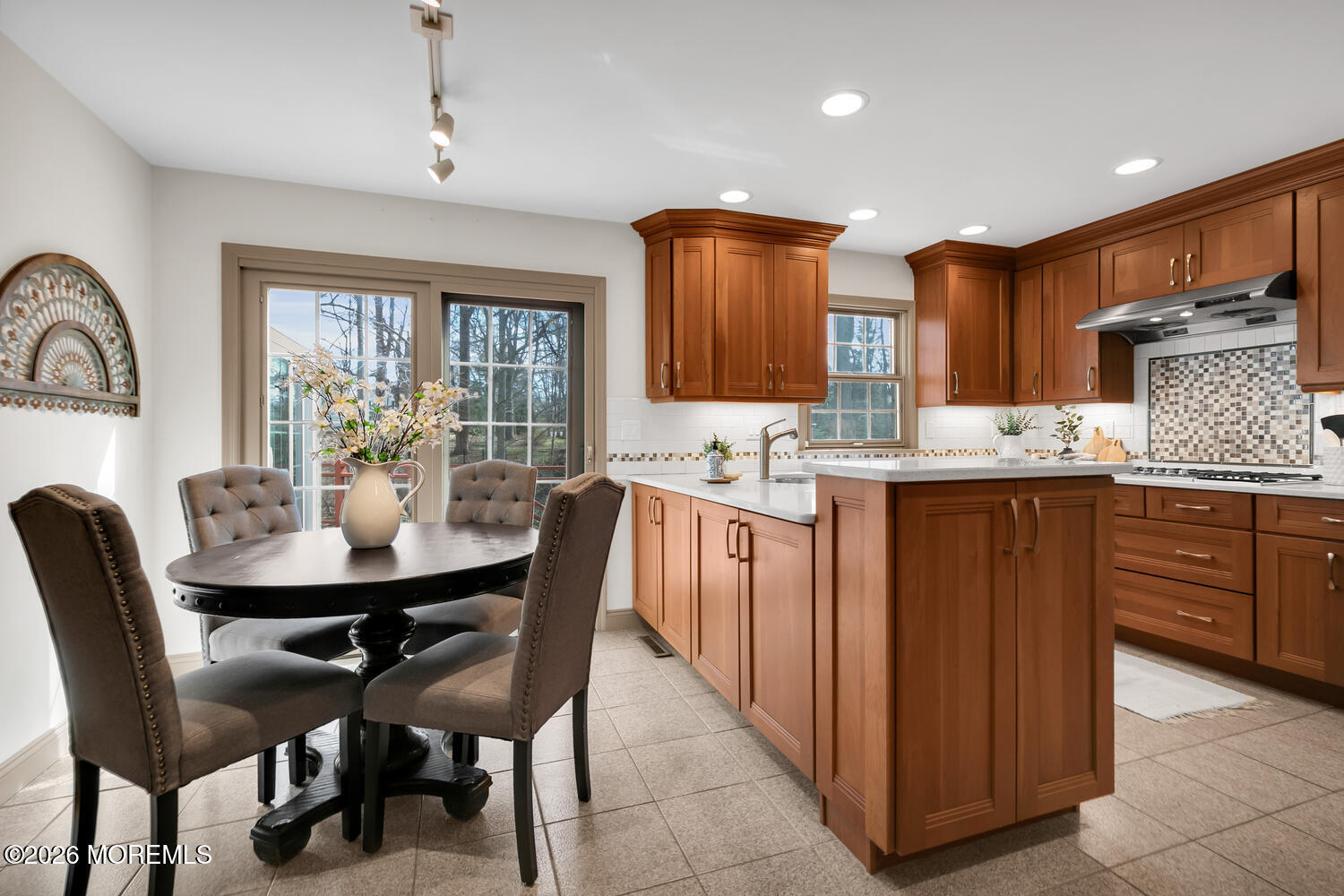 44 Tall Tree Road Middletown, NJ 07748 - Photo 53 of 62 a kitchen with a table chairs sink and cabinets