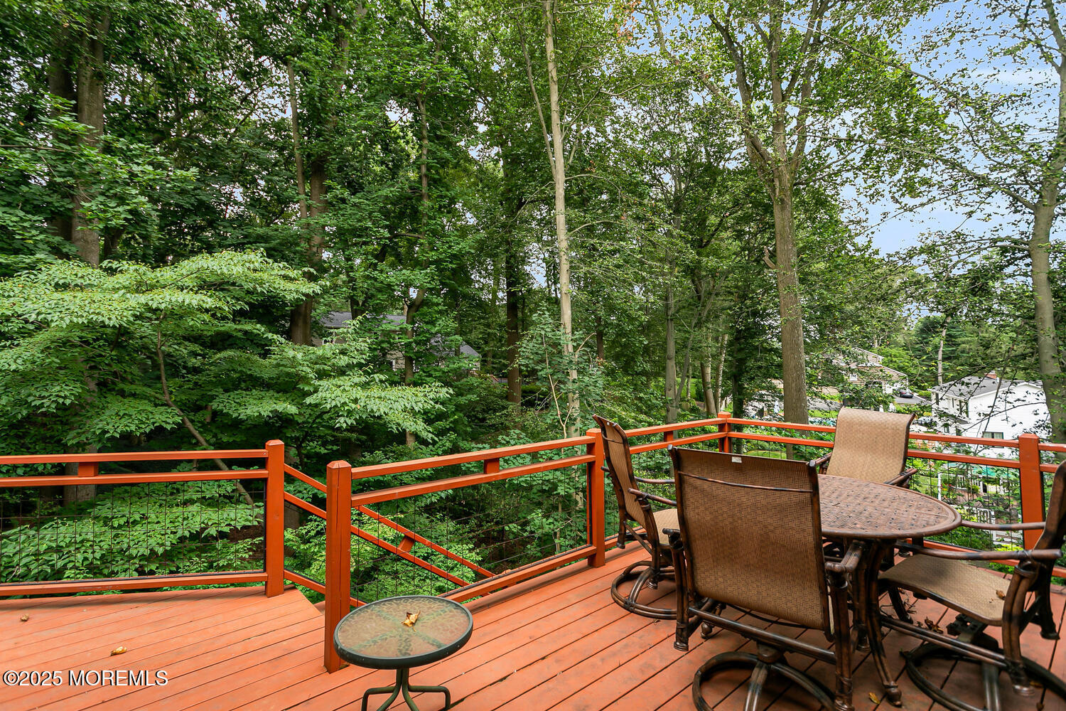44 Tall Tree Road Middletown, NJ 07748 - Photo 6 of 62 a view of a deck with wooden floor and outdoor seating