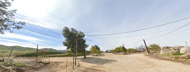 an aerial view of a houses with a yard