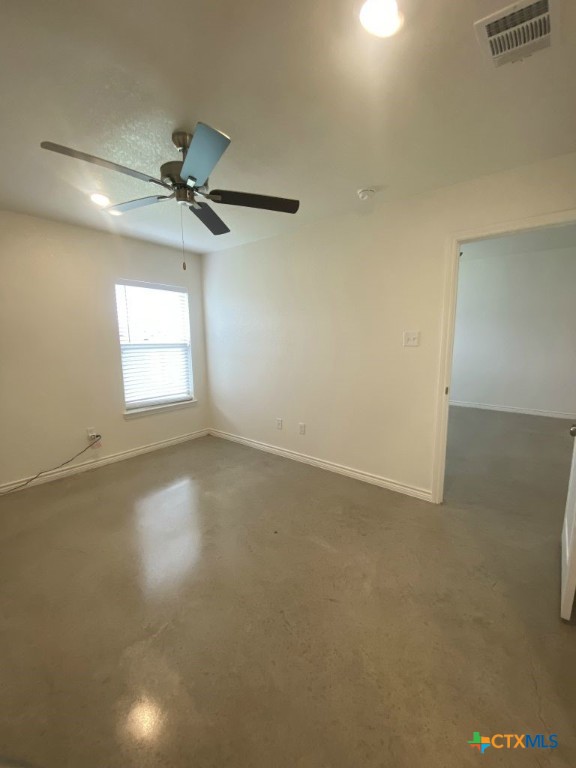 1214 Lehmann Drive, Unit A Copperas Cove, TX 76522 - Photo 14 of 24 an empty room with windows and fan