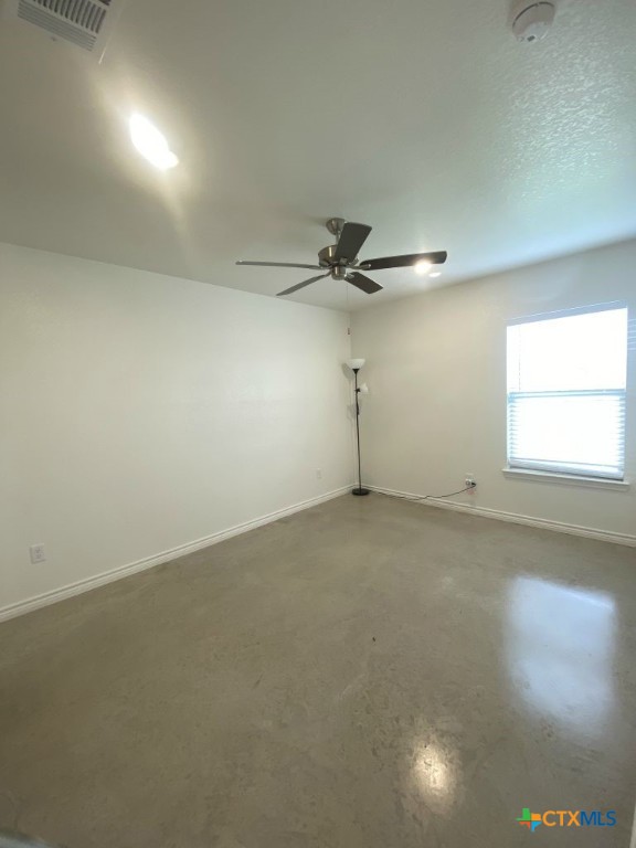 1214 Lehmann Drive, Unit A Copperas Cove, TX 76522 - Photo 15 of 24 an empty room with a ceiling fan and window