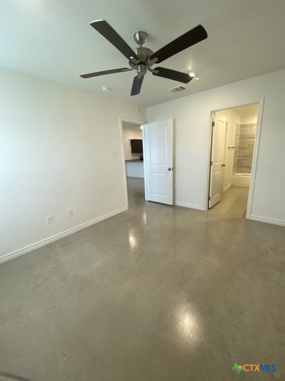 1214 Lehmann Drive, Unit A Copperas Cove, TX 76522 - Photo 16 of 24 an empty room with ceiling fan and windows