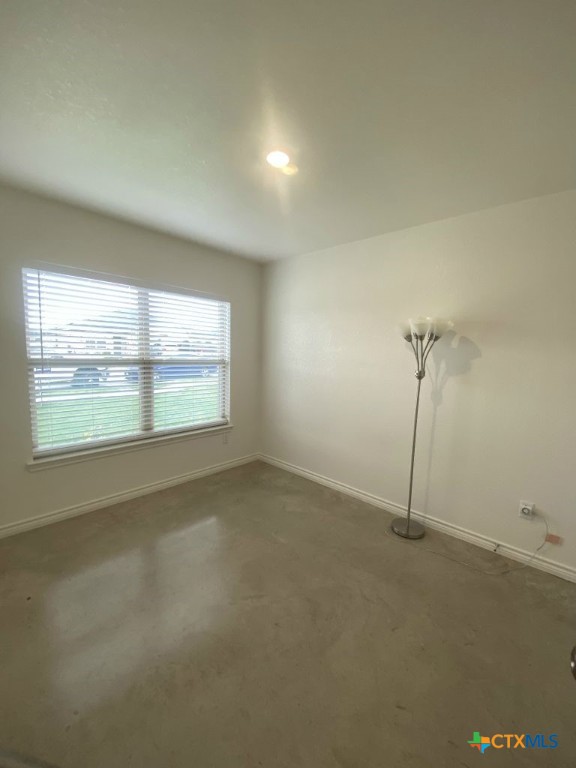 1214 Lehmann Drive, Unit A Copperas Cove, TX 76522 - Photo 19 of 24 an empty room with a empty space and windows