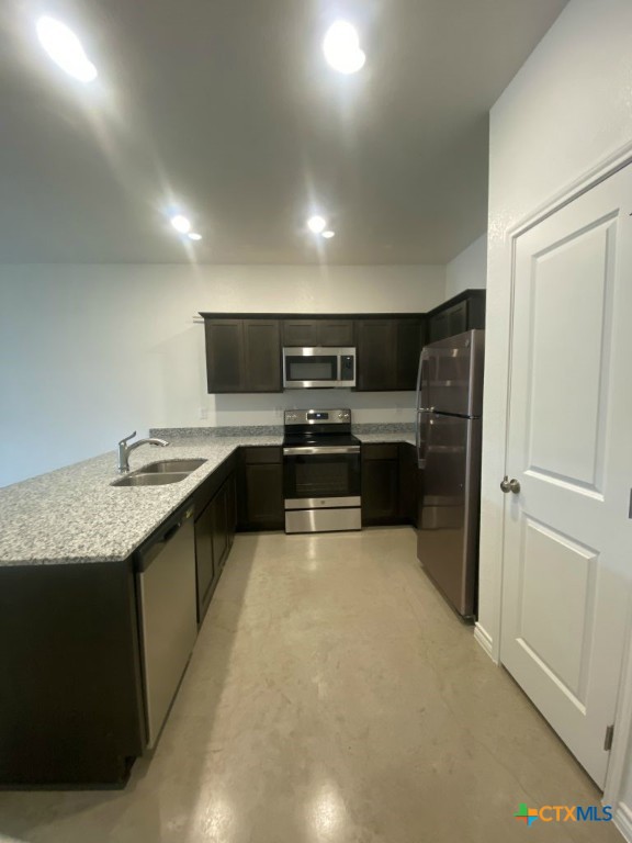 1214 Lehmann Drive, Unit A Copperas Cove, TX 76522 - Photo 6 of 24 a large kitchen with stainless steel appliances granite countertop a sink and cabinets
