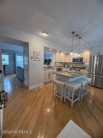 a living room with furniture potted plant and a window