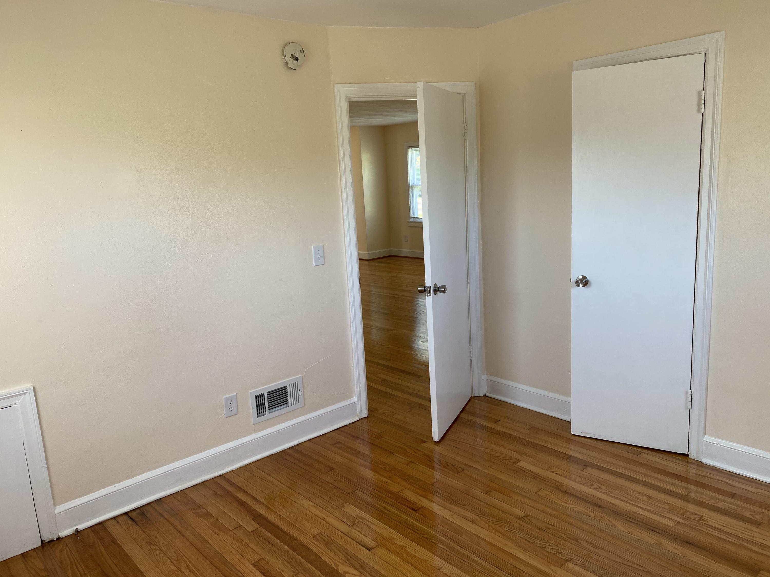3731 Cove Road Roanoke, VA 24017 - Photo 13 of 25 a view of an empty room with wooden floor and closet