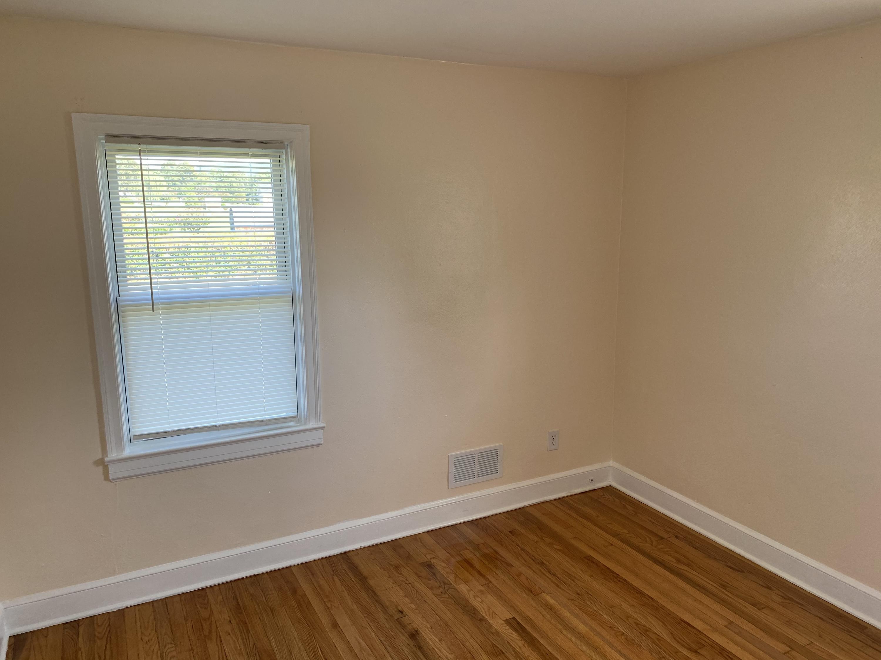 3731 Cove Road Roanoke, VA 24017 - Photo 17 of 25 a view of a small space with wooden floor and a window