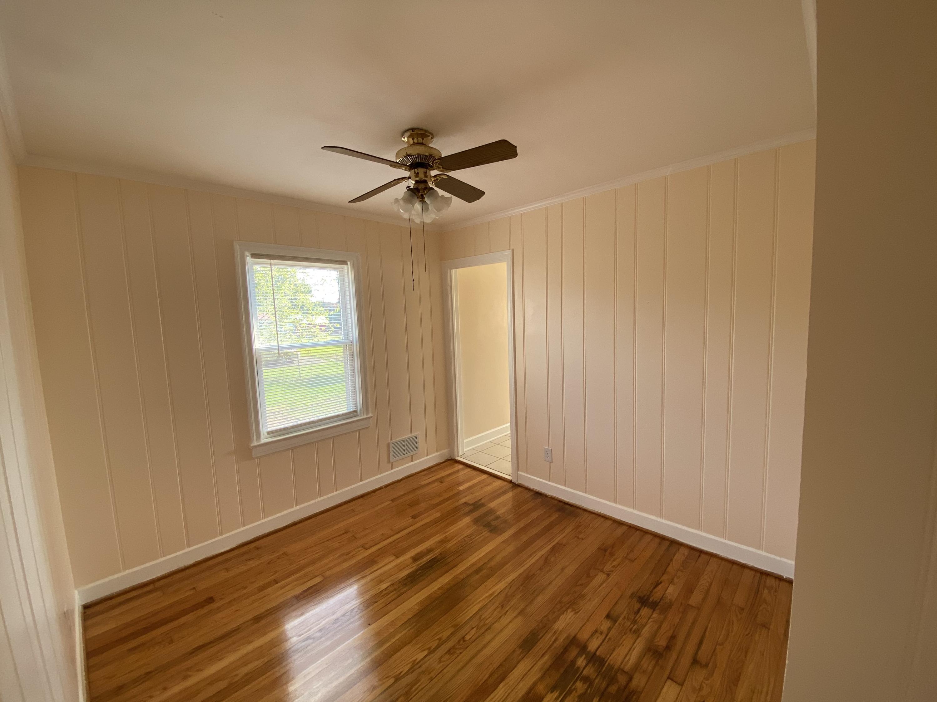 3731 Cove Road Roanoke, VA 24017 - Photo 20 of 25 a view of empty room with wooden floor and fan