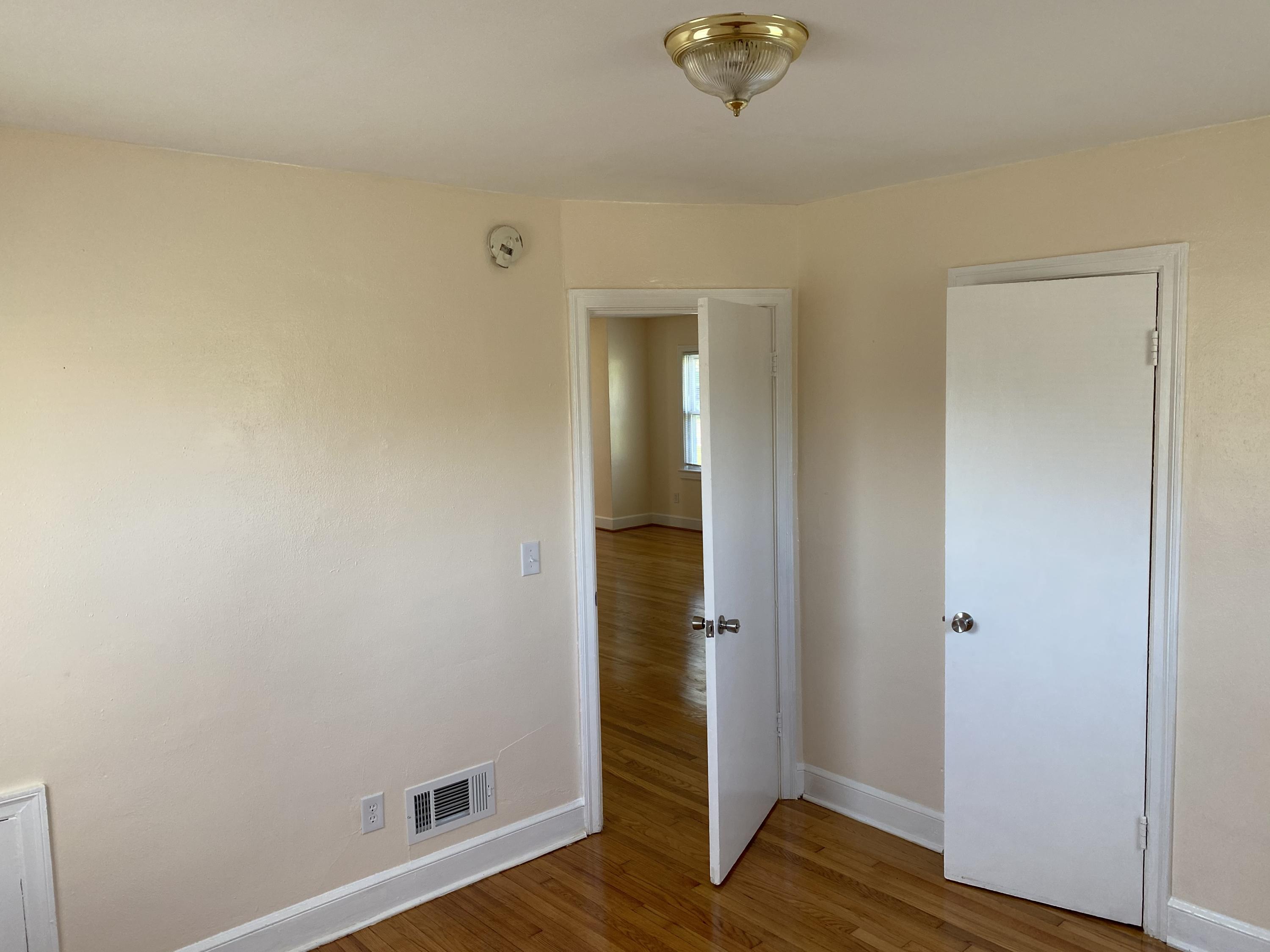 3731 Cove Road Roanoke, VA 24017 - Photo 21 of 25 an empty room with wooden floor