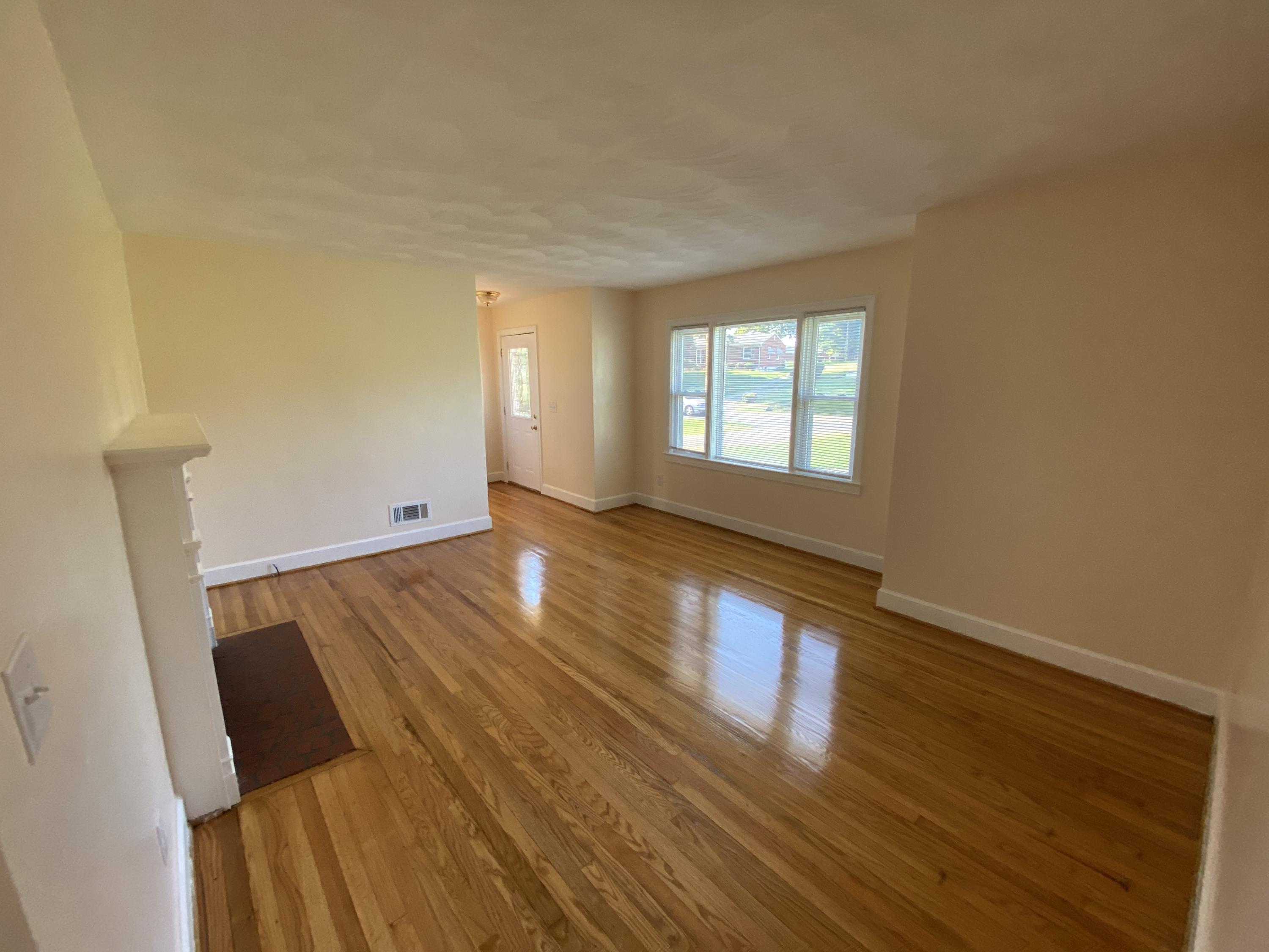 3731 Cove Road Roanoke, VA 24017 - Photo 6 of 25 wooden floor in an empty room with a window