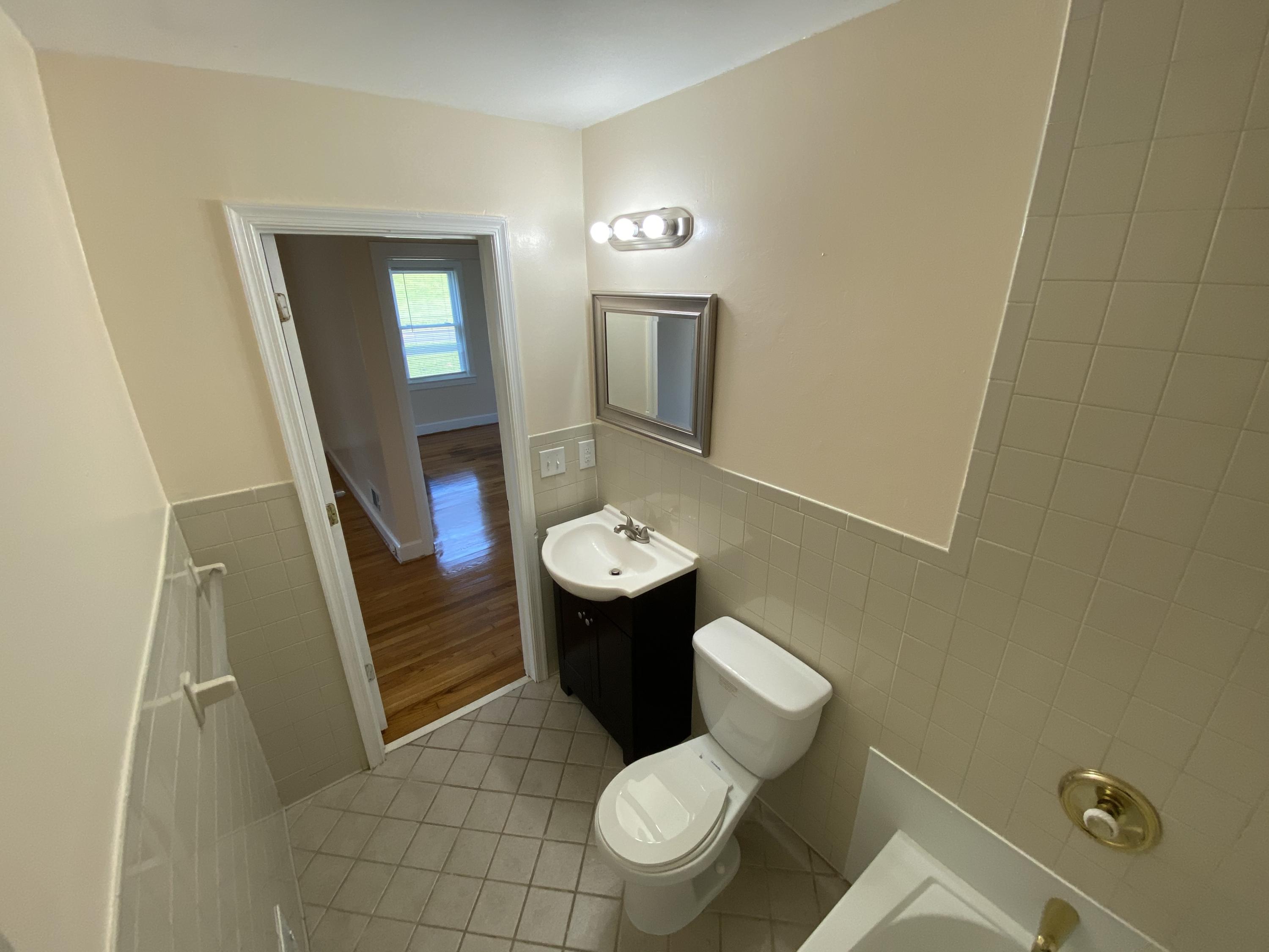 3731 Cove Road Roanoke, VA 24017 - Photo 9 of 25 a bathroom with a toilet and a sink