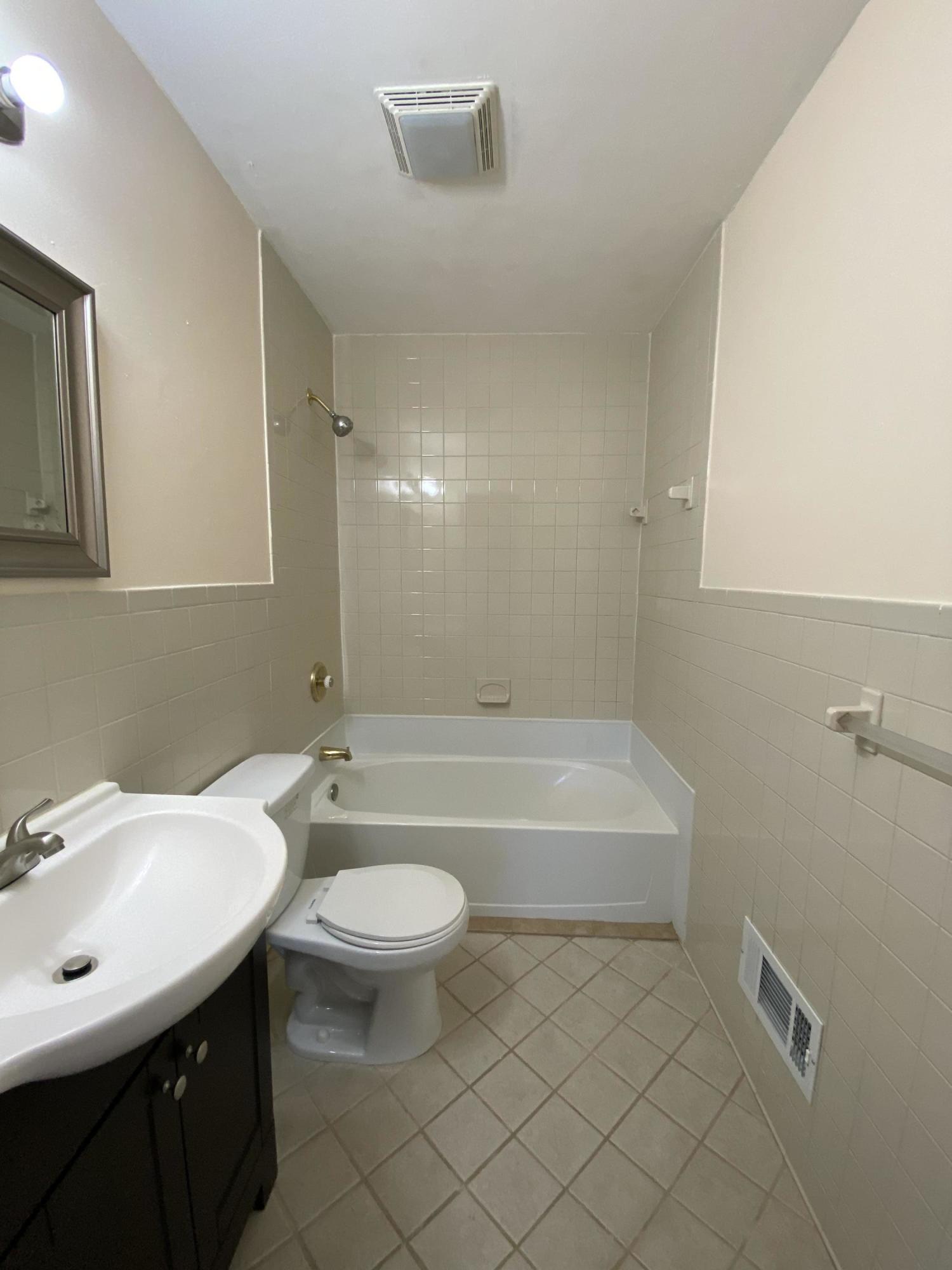 3731 Cove Road Roanoke, VA 24017 - Photo 10 of 25 a bathroom with a sink a toilet and shower