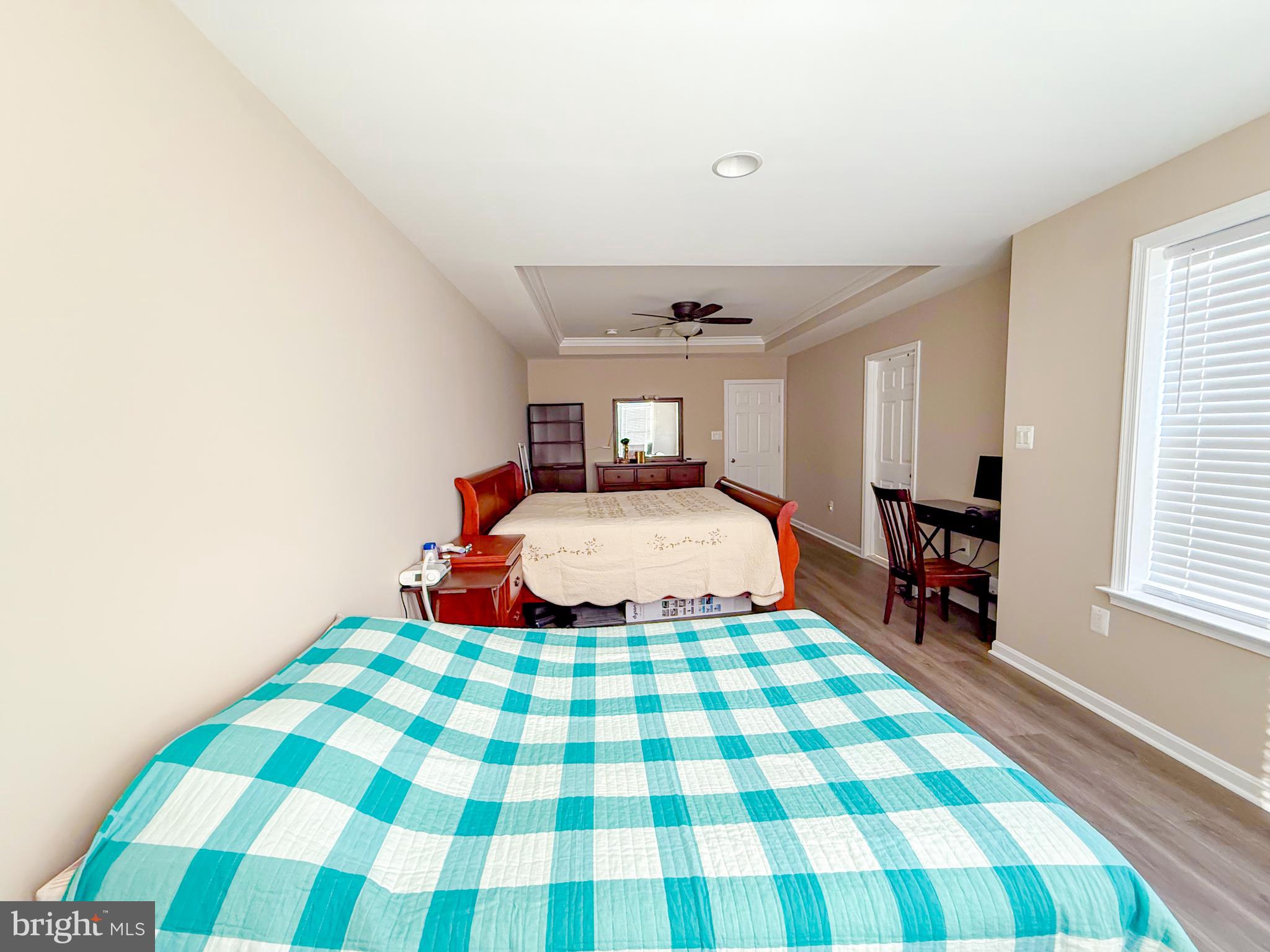 42258 Dean Chapel Square Chantilly, VA 20152 - Photo 16 of 35 a bedroom with a bed and wooden floor