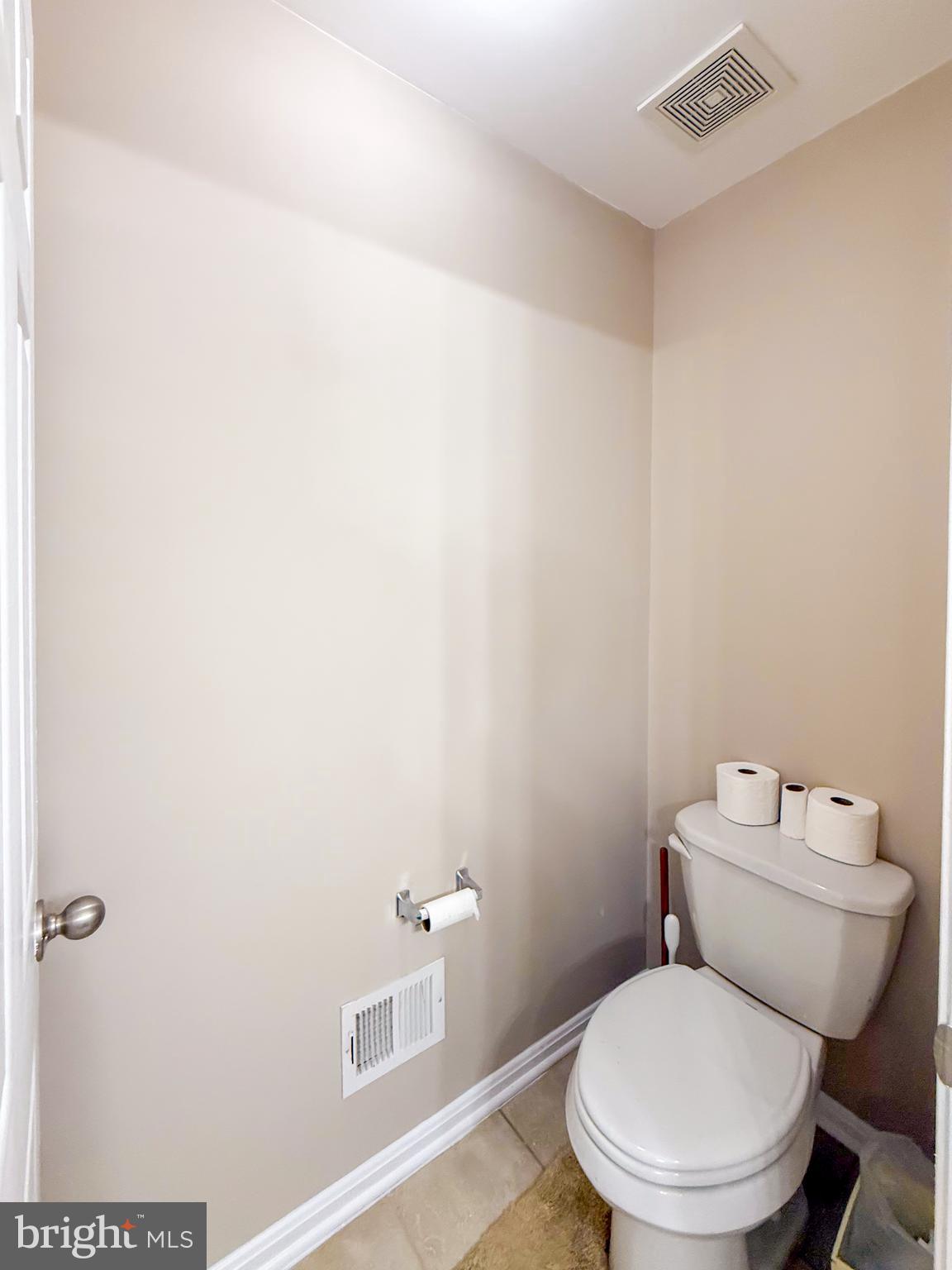 42258 Dean Chapel Square Chantilly, VA 20152 - Photo 22 of 35 a white toilet sitting next to a bathroom sink