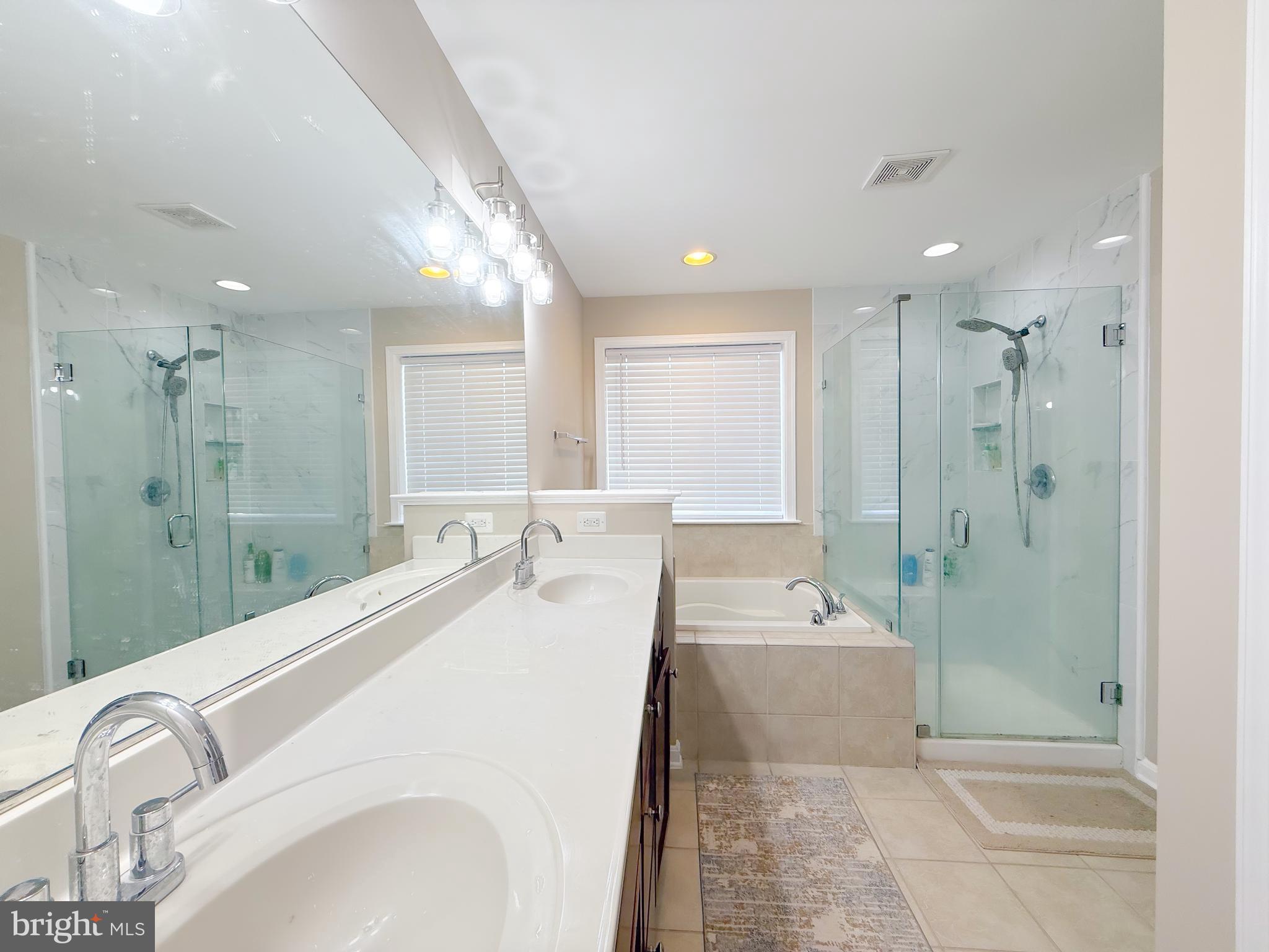 42258 Dean Chapel Square Chantilly, VA 20152 - Photo 23 of 35 a spacious bathroom with a double vanity sink shower and a mirror
