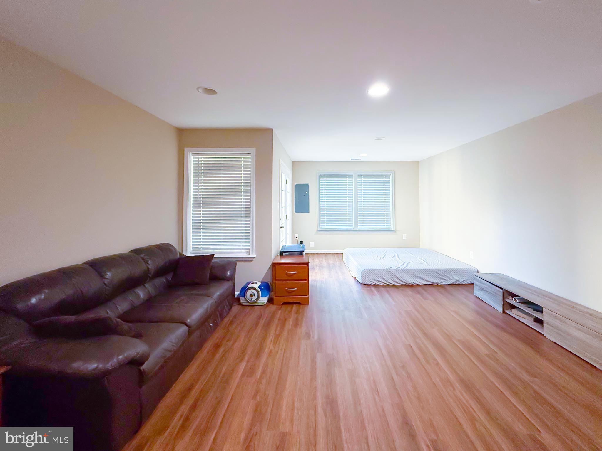 42258 Dean Chapel Square Chantilly, VA 20152 - Photo 25 of 35 a living room with furniture and a wooden floor