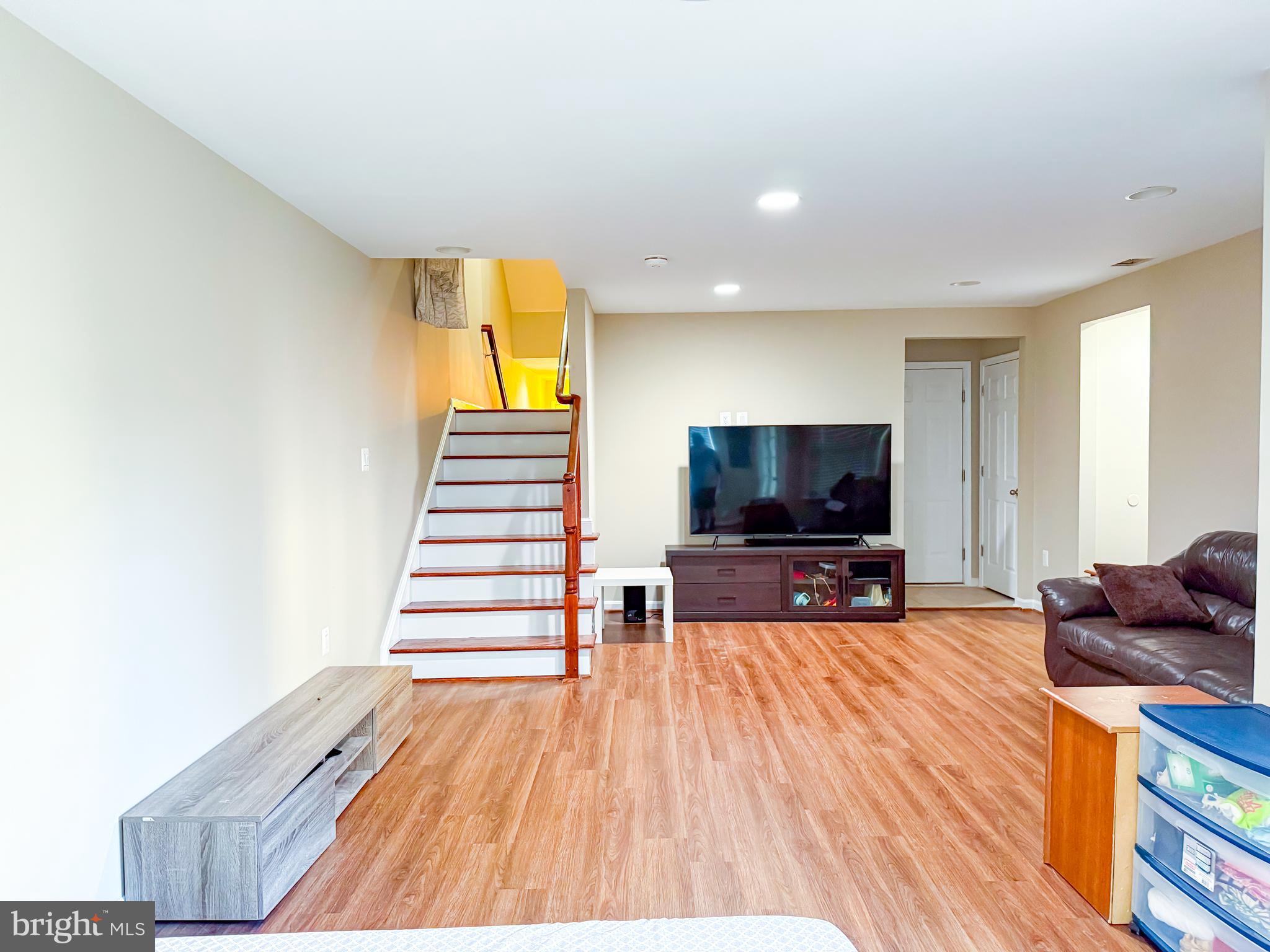 42258 Dean Chapel Square Chantilly, VA 20152 - Photo 26 of 35 a living room with furniture and a flat screen tv