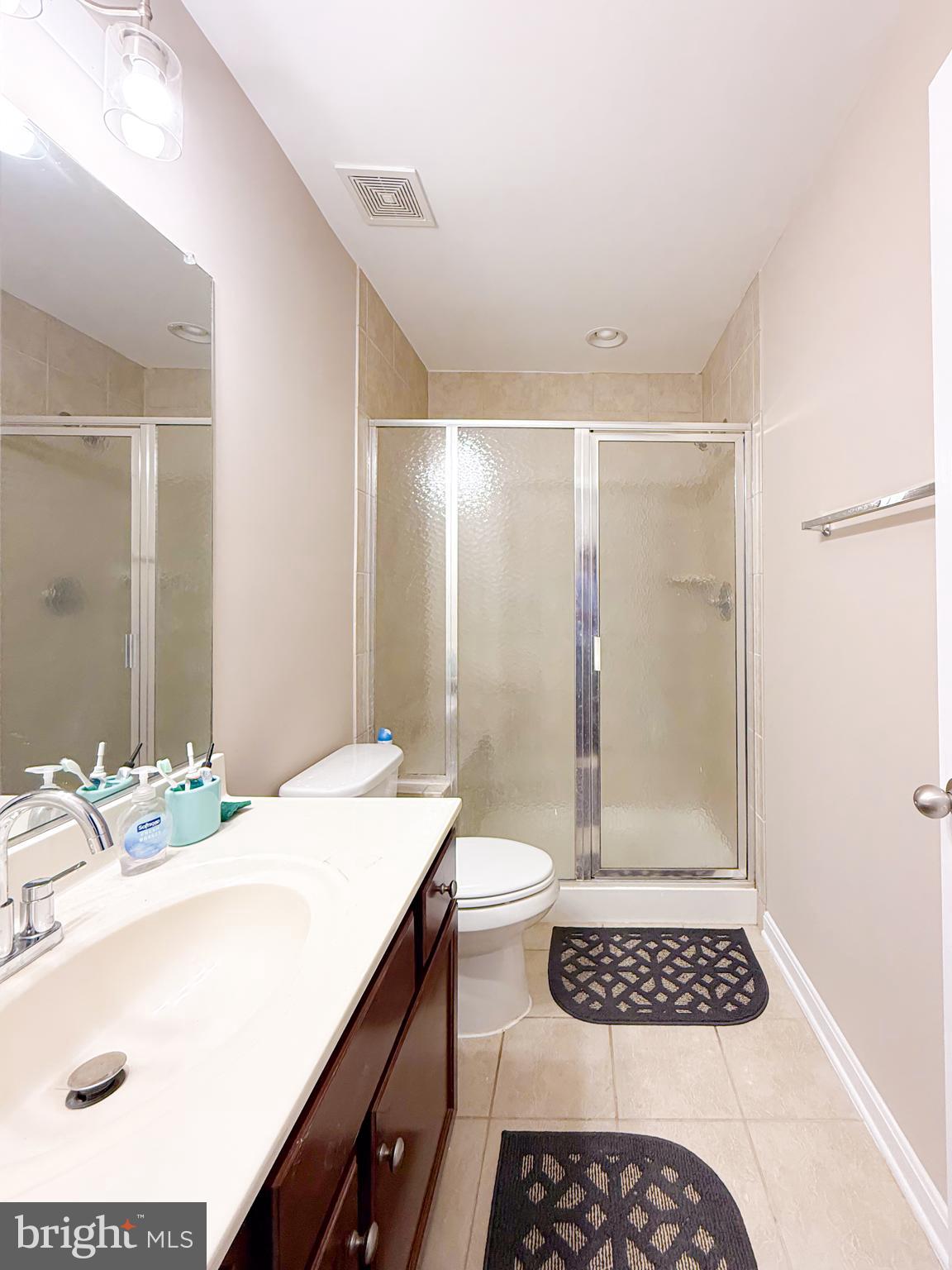 42258 Dean Chapel Square Chantilly, VA 20152 - Photo 27 of 35 a bathroom with a sink a mirror and a shower