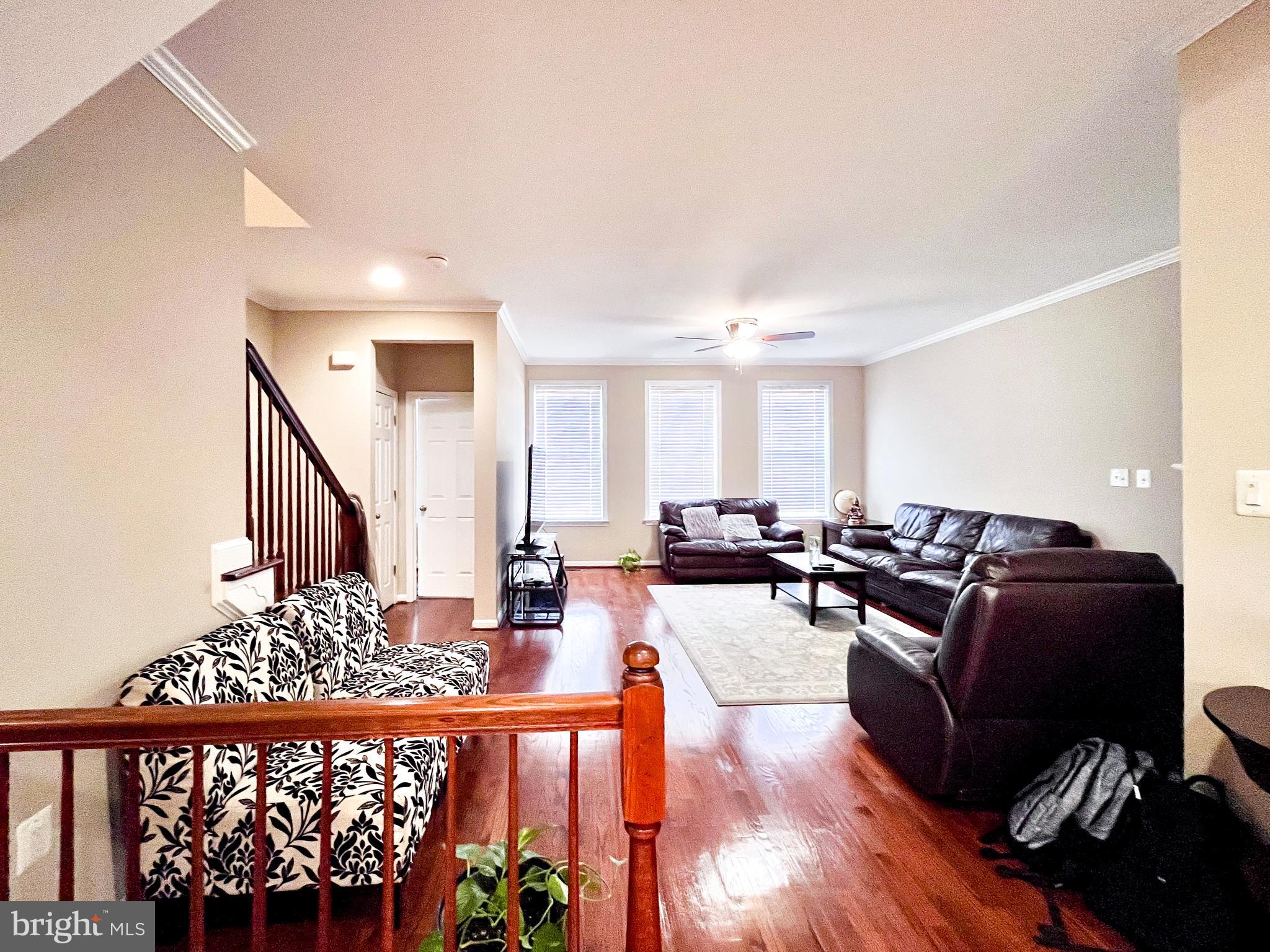 42258 Dean Chapel Square Chantilly, VA 20152 - Photo 29 of 35 a living room with furniture wooden floor and a large window
