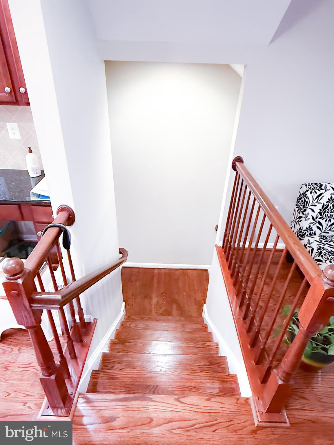 42258 Dean Chapel Square Chantilly, VA 20152 - Photo 5 of 35 a view of stairs and with wooden floor