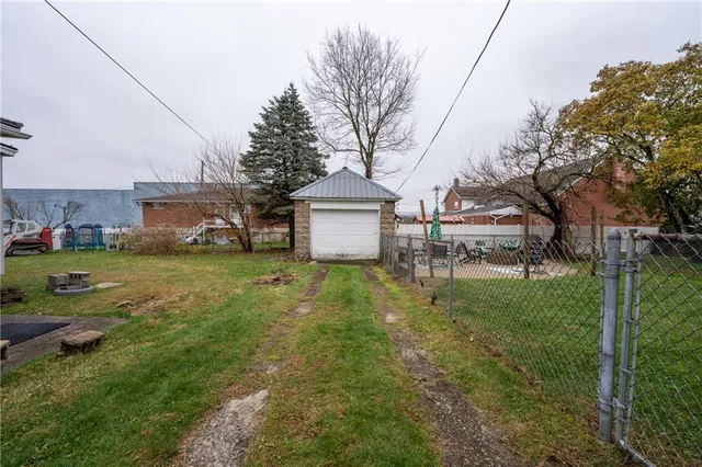 an aerial view of a house with a garden and plants