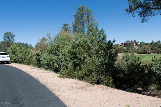 a view of a road with a building in the background