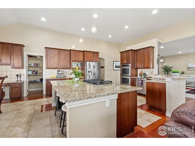 a view of a dining room with furniture and a window