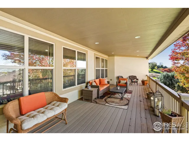 a view of a balcony with furniture