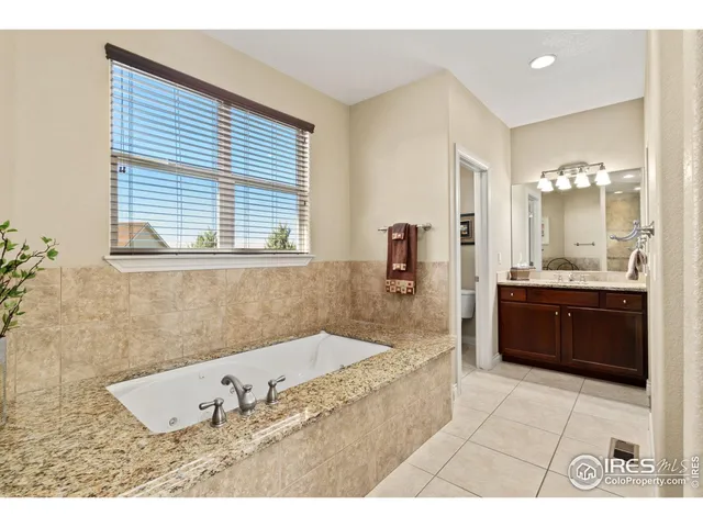 a bathroom with a bathtub and a sink