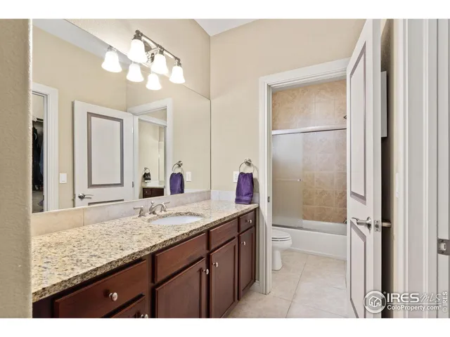 a view of a house with backyard sitting area and garden