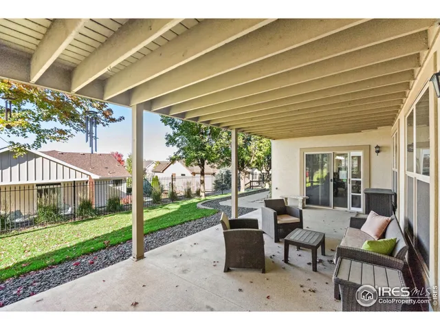 a view of a house with backyard porch and sitting area
