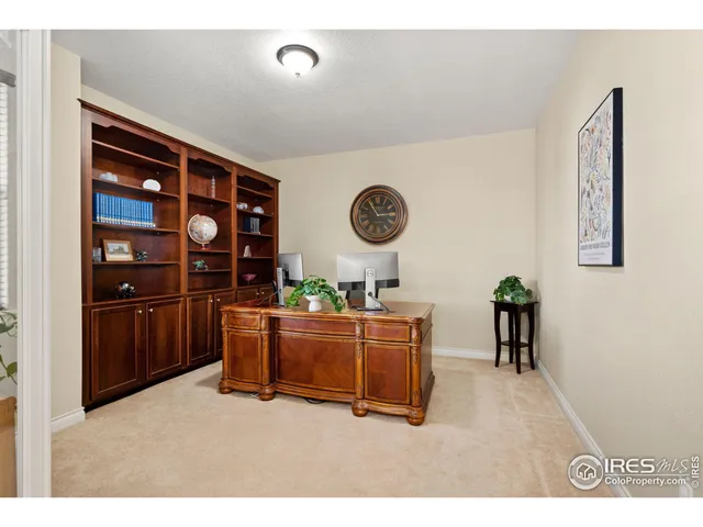 a bathroom with a granite countertop sink a toilet and mirror