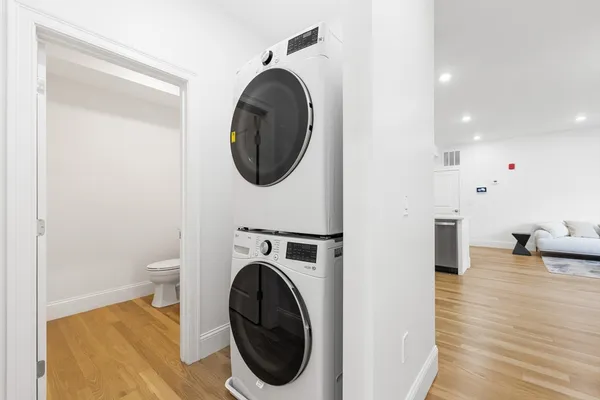 a view of a hallway with washer and dryer