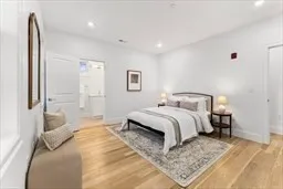 a bedroom with a large bed and a couch