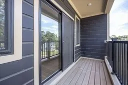 a view of a balcony with wooden floor