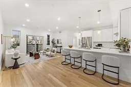 a view of a dining room and hall with furniture