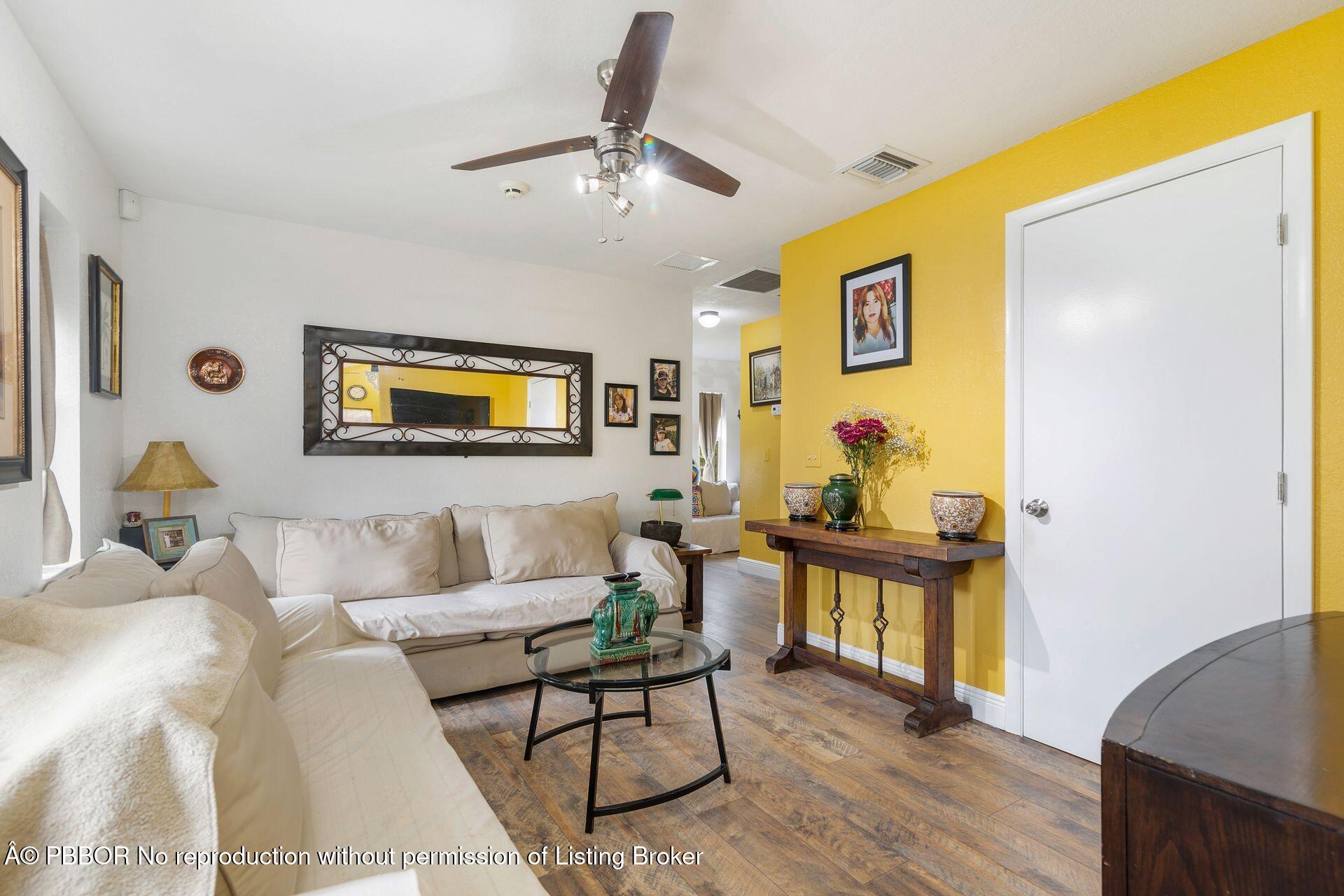 2770 E Road Loxahatchee, FL 33470 - Photo 29 of 51 a living room with furniture and wooden floor