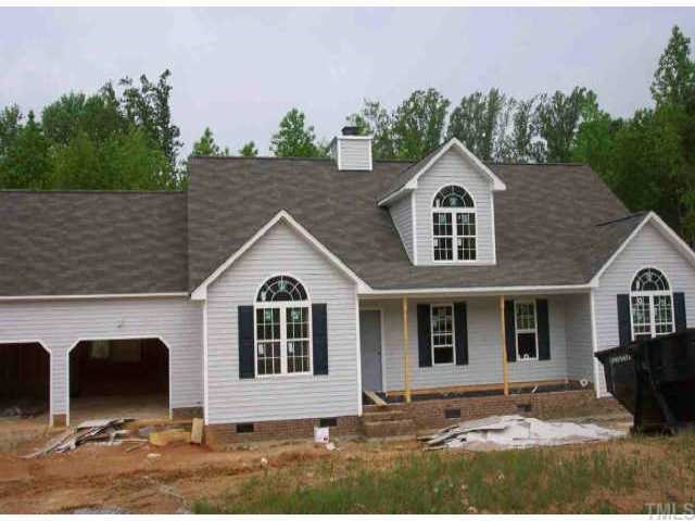 8436 Ridgebury Road Raleigh, NC 27603 - Photo 1 of 1 a front view of a house with garden