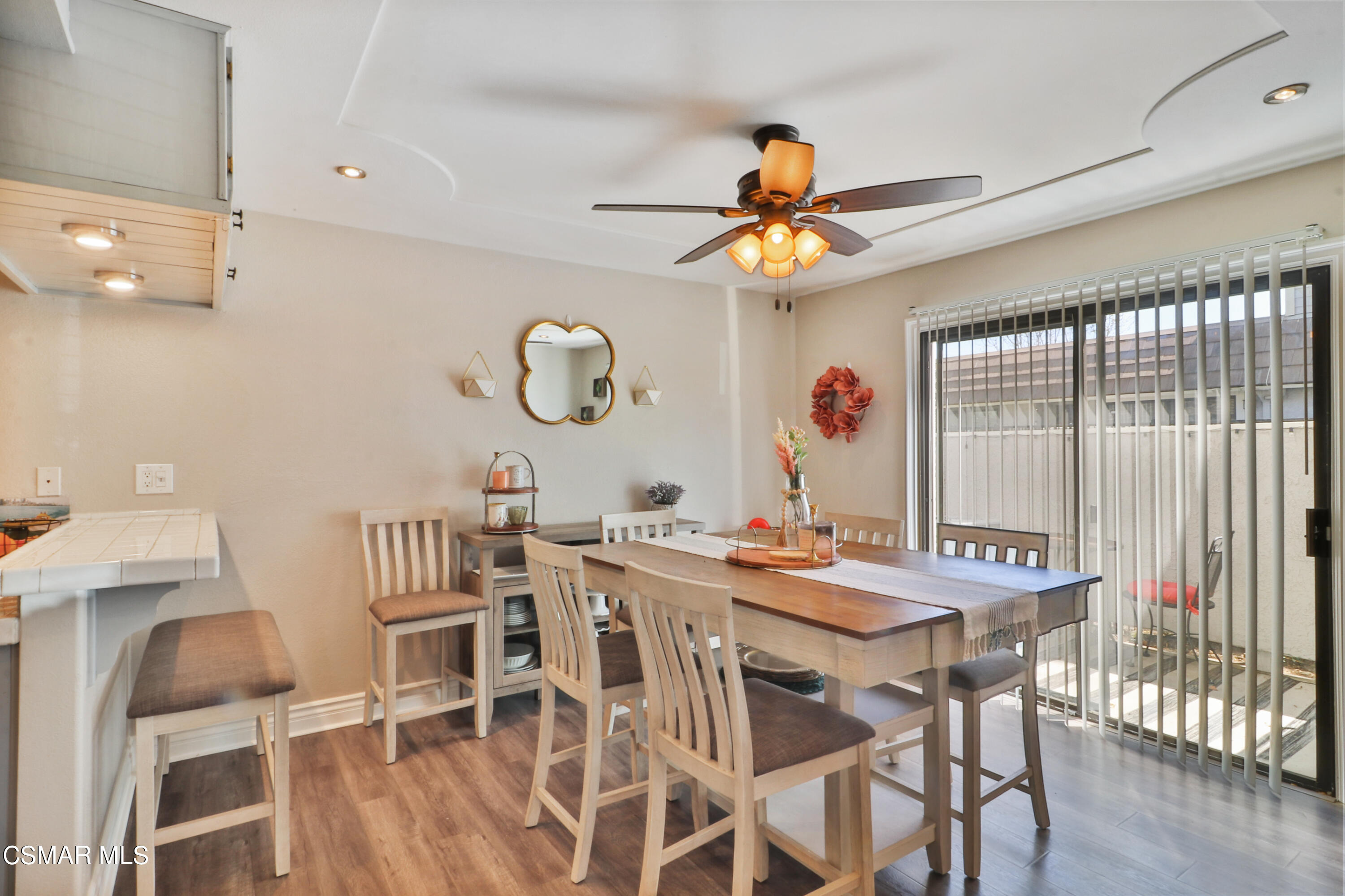 2346 Royal Avenue, Unit 9 Simi Valley, CA 93065 - Photo 13 of 31 a view of a dining room and a table and chairs