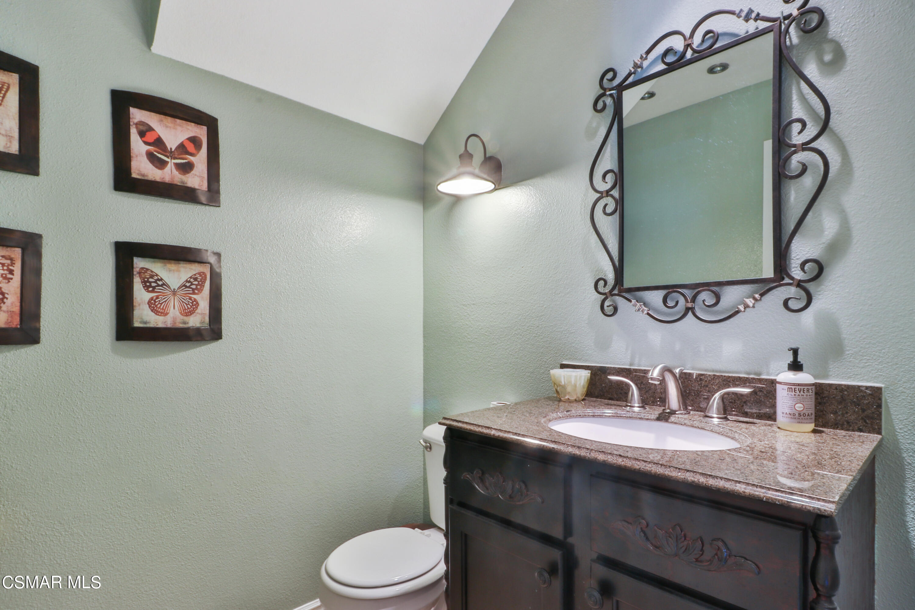2346 Royal Avenue, Unit 9 Simi Valley, CA 93065 - Photo 20 of 31 a bathroom with a toilet sink and mirror