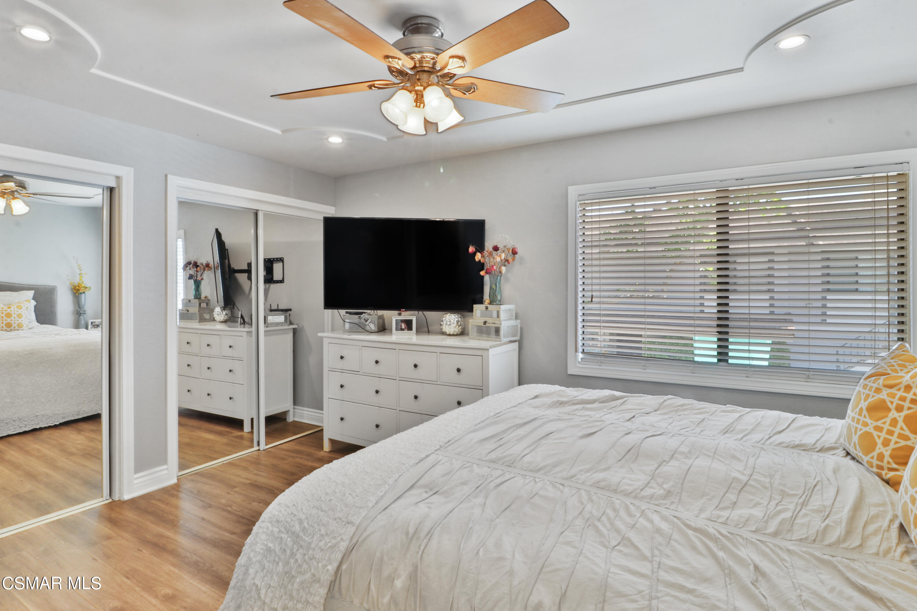 2346 Royal Avenue, Unit 9 Simi Valley, CA 93065 - Photo 23 of 31 a bedroom with a bed and a flat tv screen on dresser
