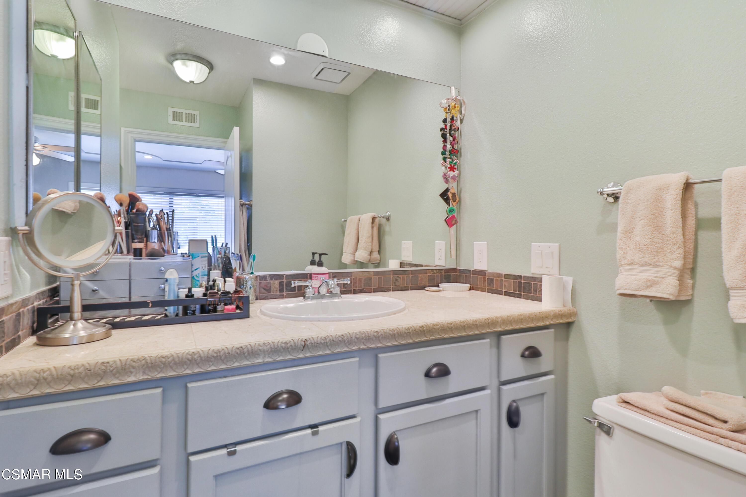 2346 Royal Avenue, Unit 9 Simi Valley, CA 93065 - Photo 25 of 31 a bathroom with a sink and a mirror