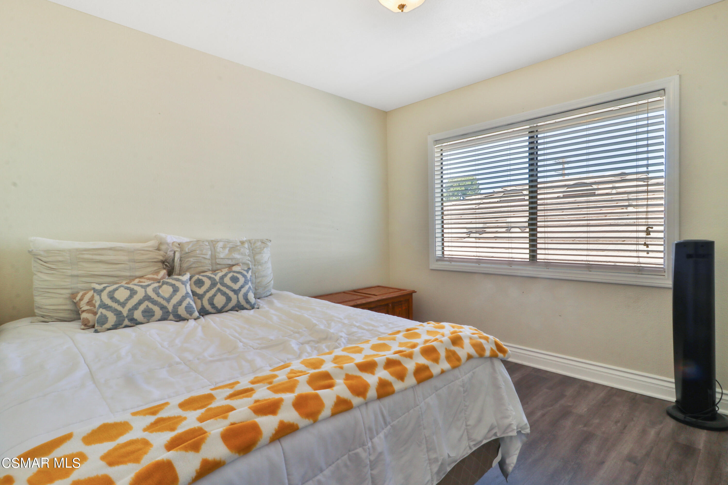 2346 Royal Avenue, Unit 9 Simi Valley, CA 93065 - Photo 26 of 31 a bedroom with a bed and a window