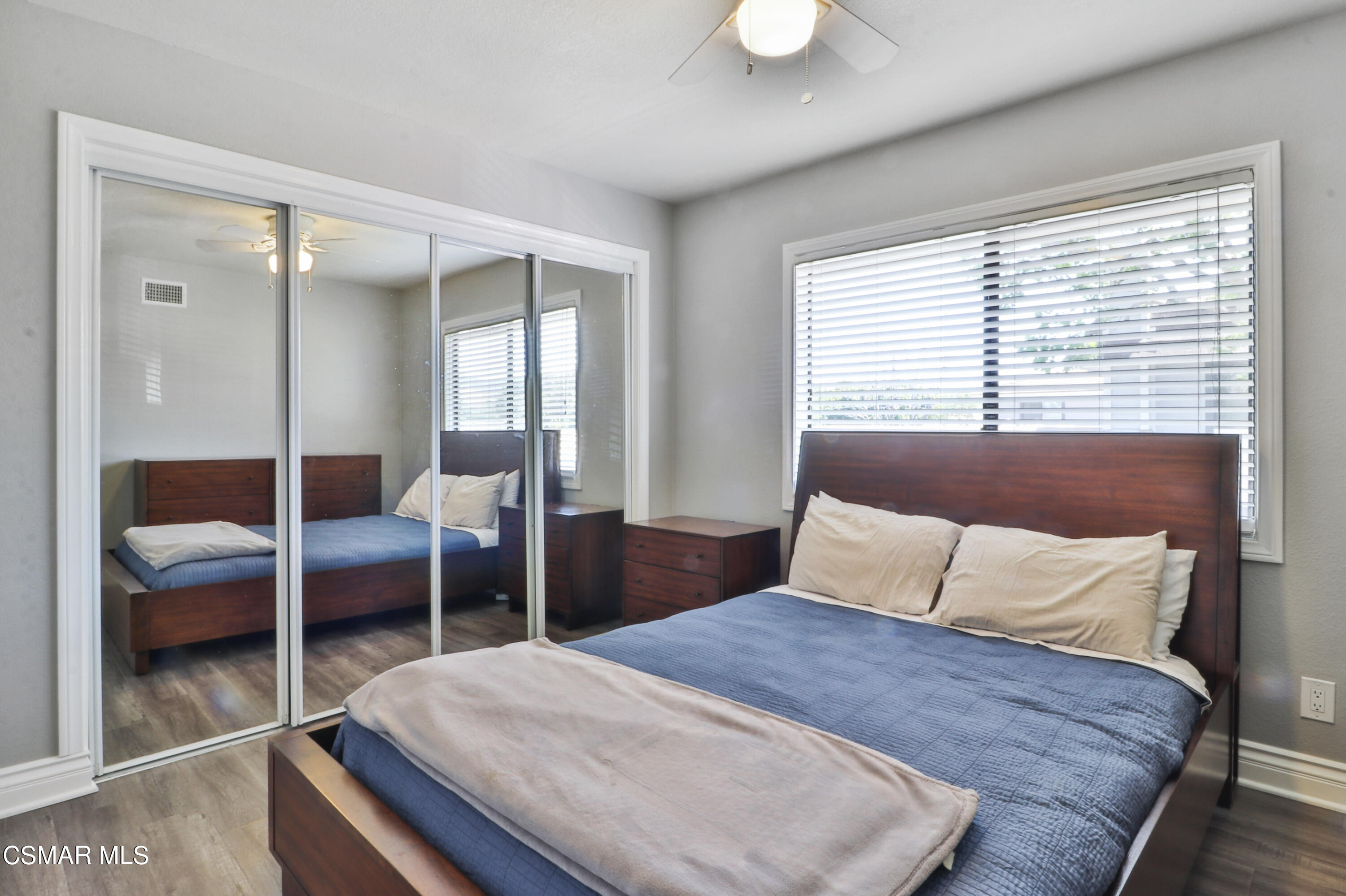 2346 Royal Avenue, Unit 9 Simi Valley, CA 93065 - Photo 27 of 31 a bedroom with a bed and a lamp with window