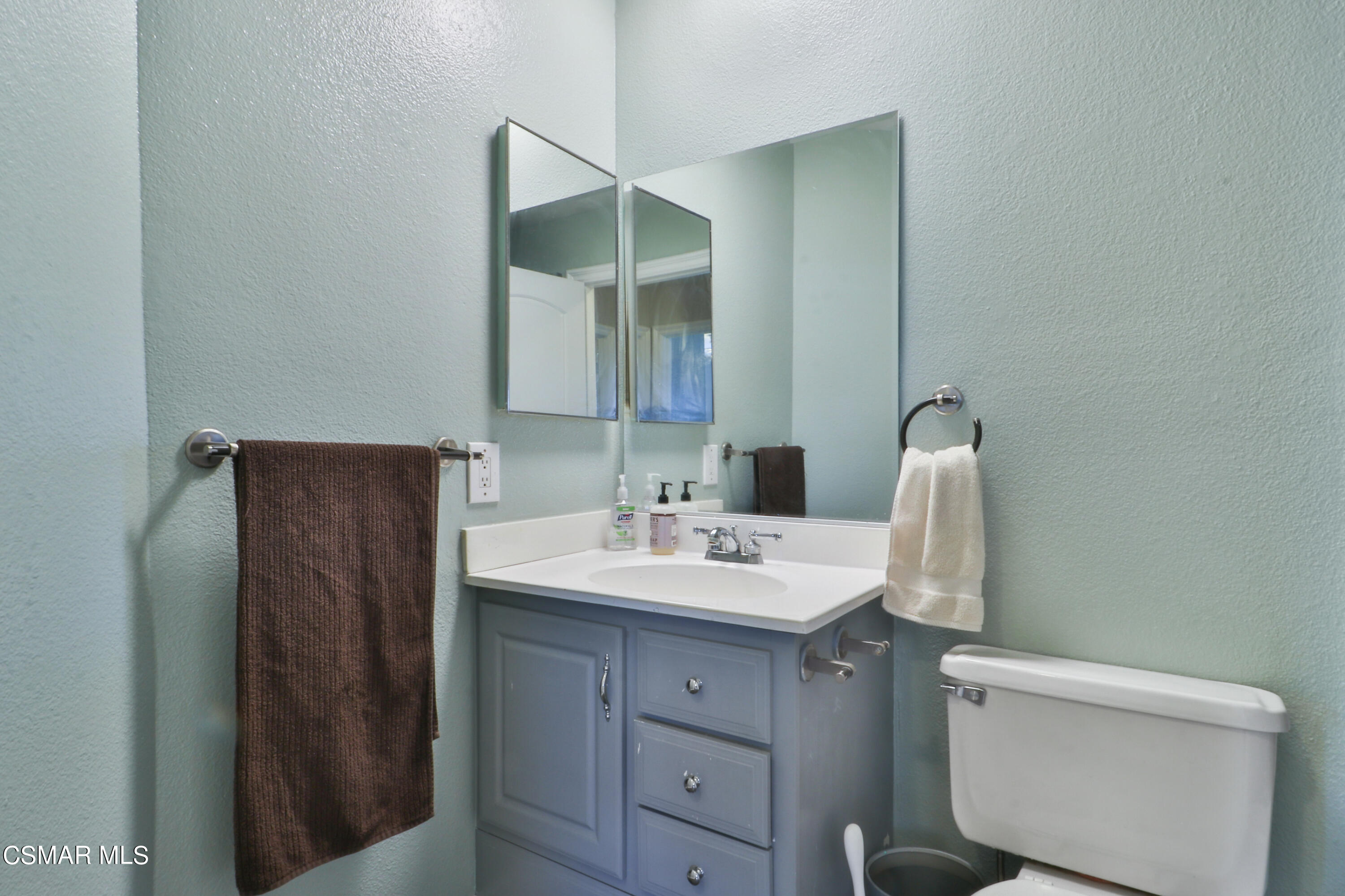 2346 Royal Avenue, Unit 9 Simi Valley, CA 93065 - Photo 28 of 31 a bathroom with a sink toilet and mirror