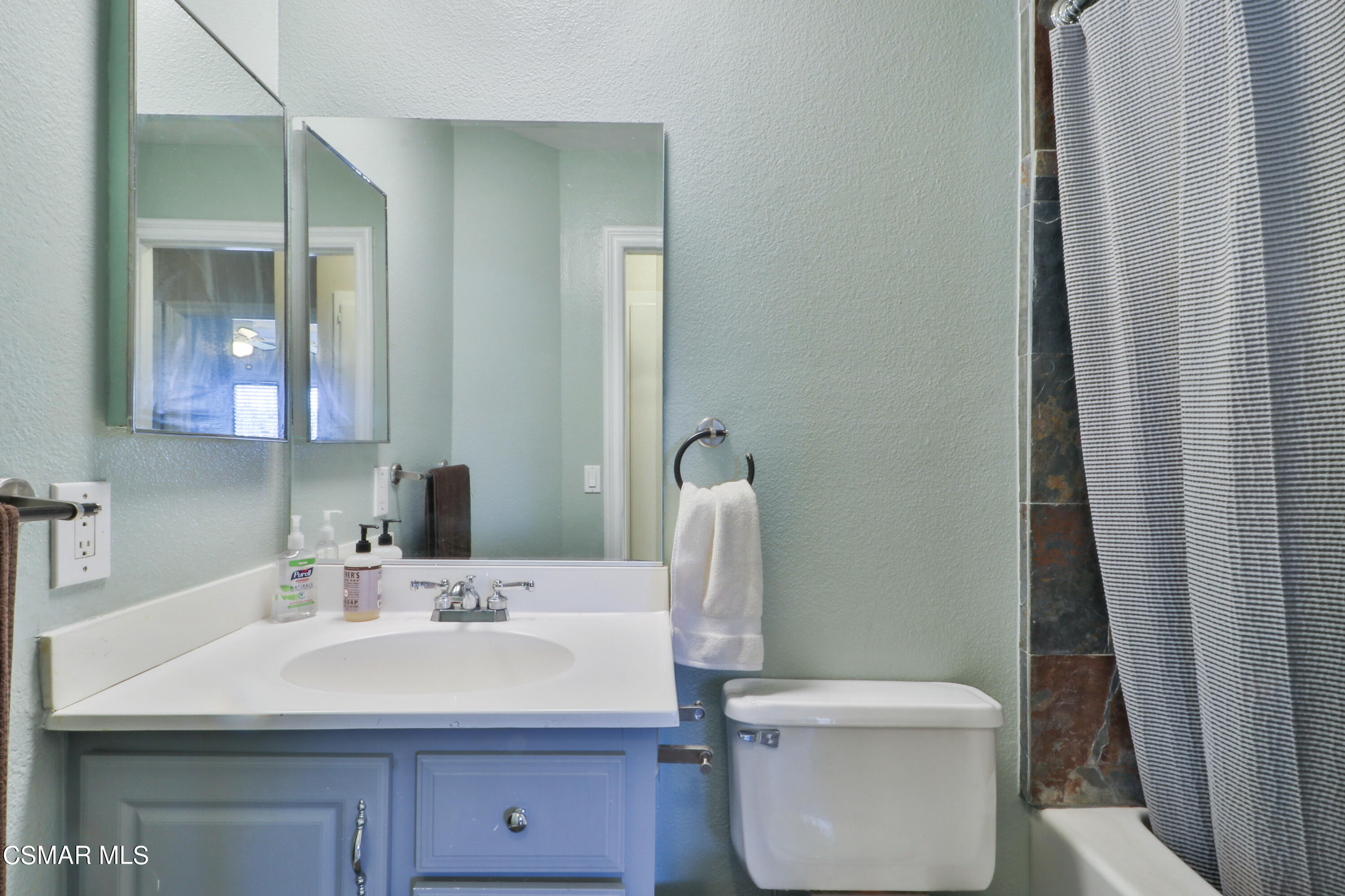 2346 Royal Avenue, Unit 9 Simi Valley, CA 93065 - Photo 29 of 31 a bathroom with a sink toilet and a mirror