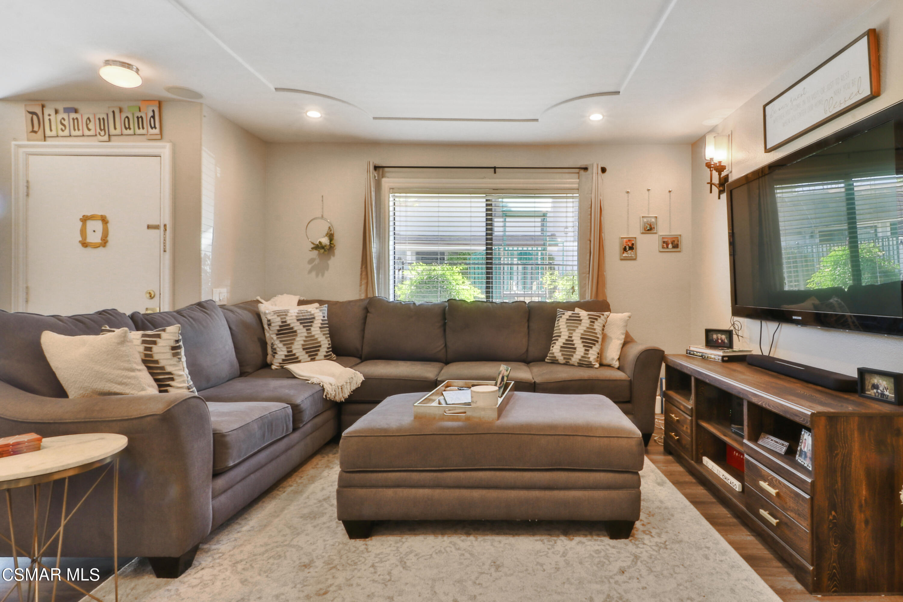 2346 Royal Avenue, Unit 9 Simi Valley, CA 93065 - Photo 5 of 31 a living room with a couch and a flat screen tv