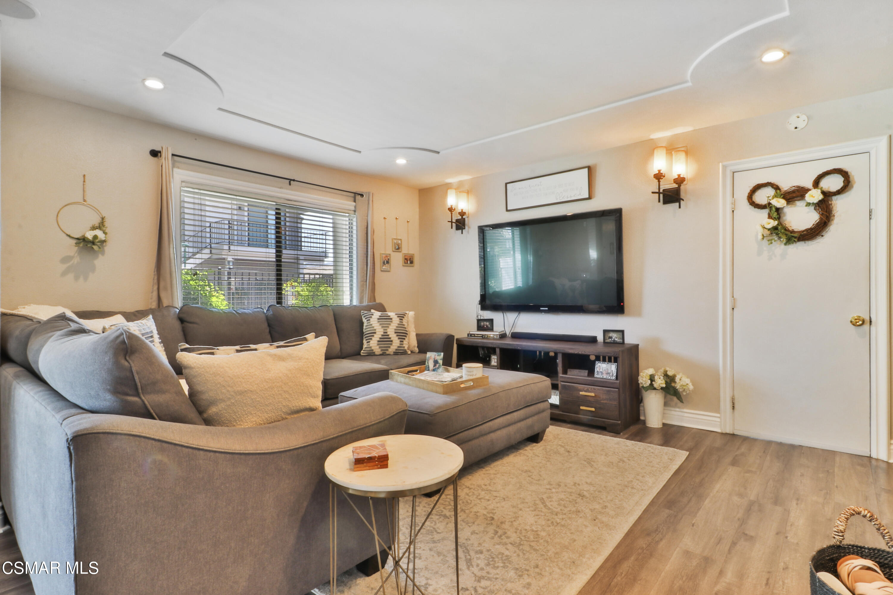 2346 Royal Avenue, Unit 9 Simi Valley, CA 93065 - Photo 6 of 31 a living room with furniture and a flat screen tv