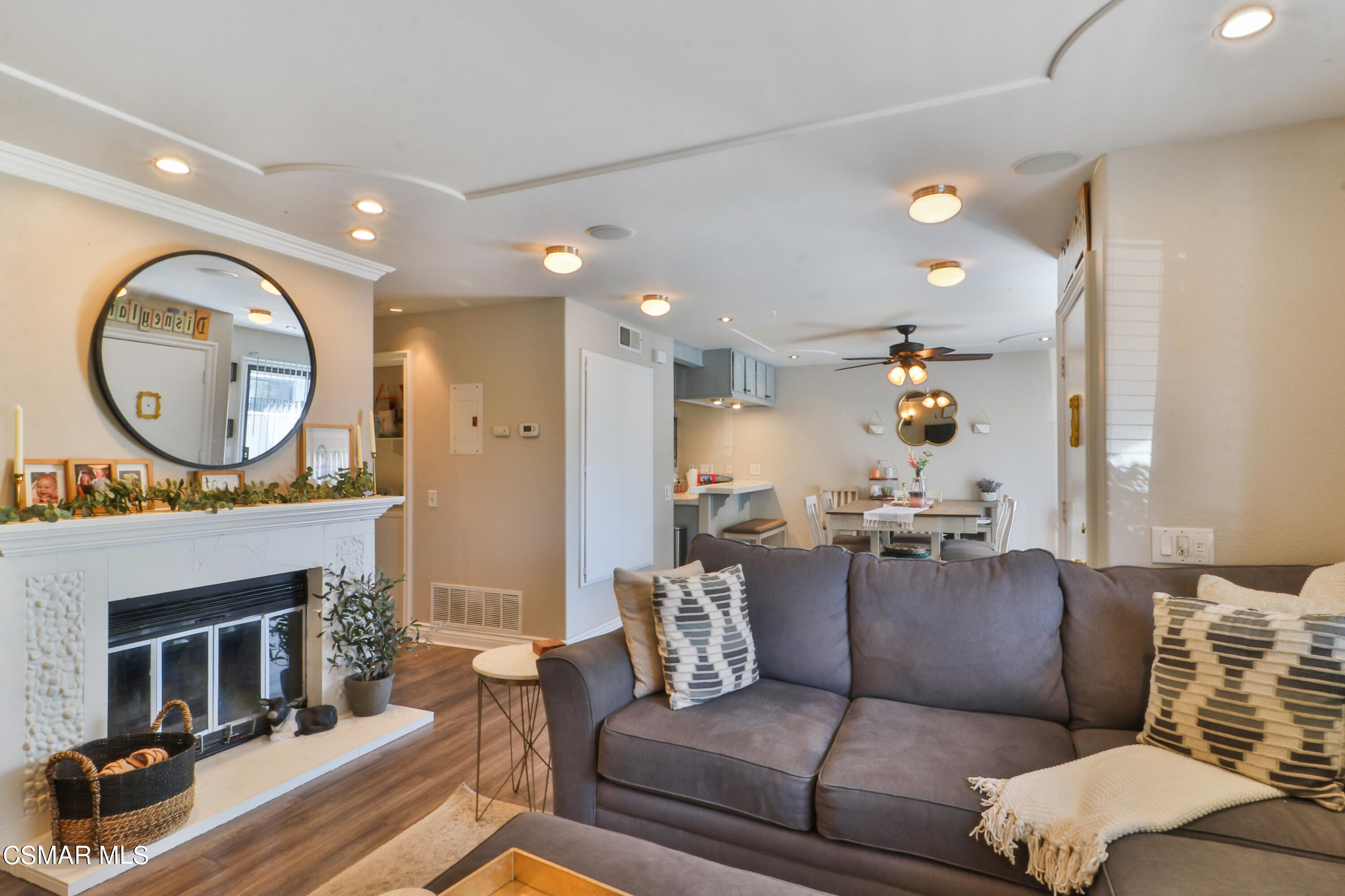 2346 Royal Avenue, Unit 9 Simi Valley, CA 93065 - Photo 9 of 31 a living room with furniture a fireplace and a large window