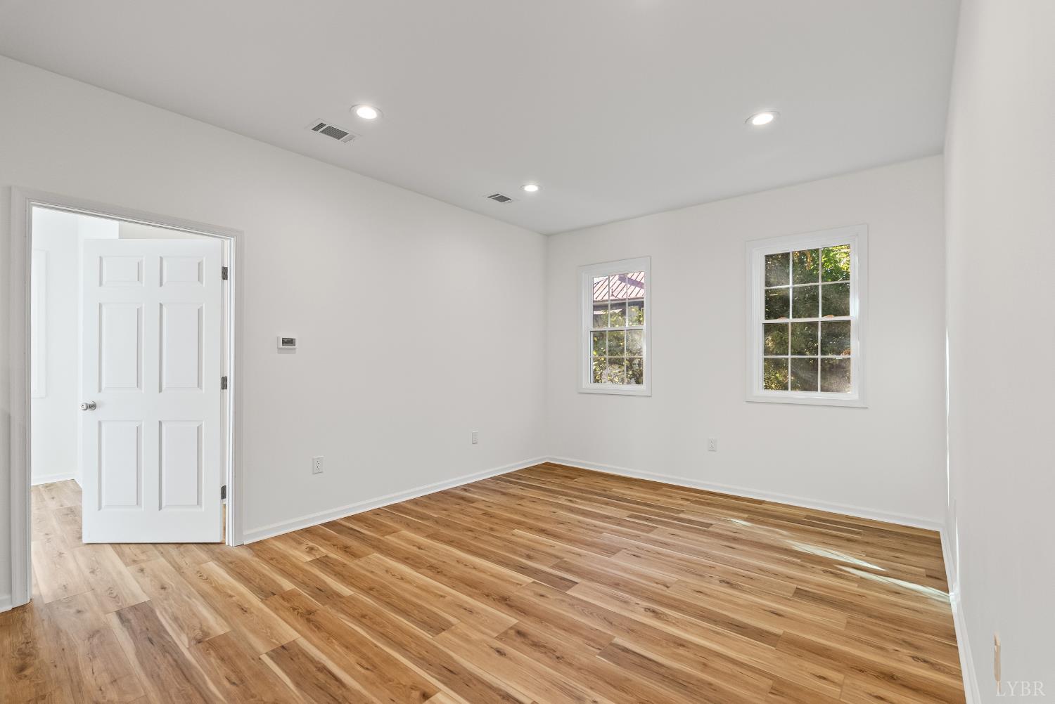 504 Amherst Street Lynchburg, VA 24504 - Photo 11 of 37 a view of empty room with wooden floor and fan